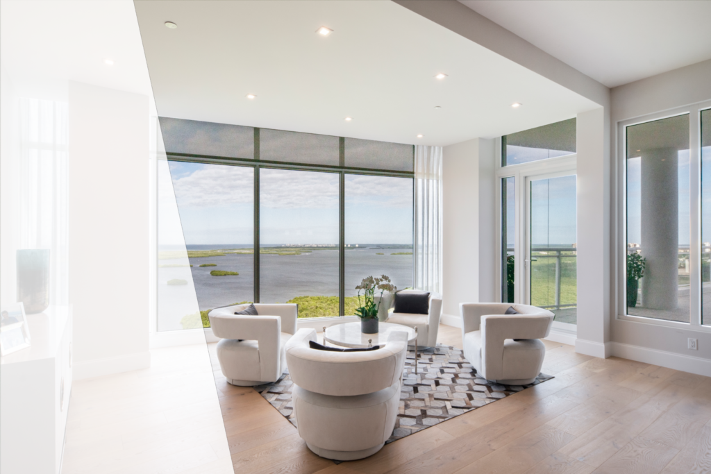Modern living room with black screen shades overlooking Estero Bay