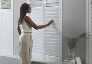 How do plantation shutters open and close